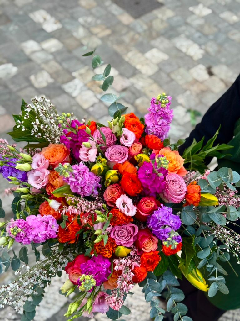 Vibrant multicolour bouquet with mixed roses.