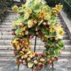 a wreath of flowers on a stone staircase