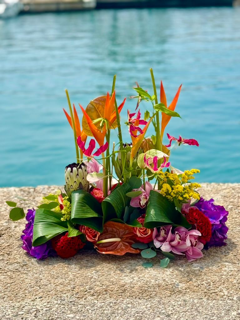 Tropical seaside centrepiece with colourful exotic flowers.